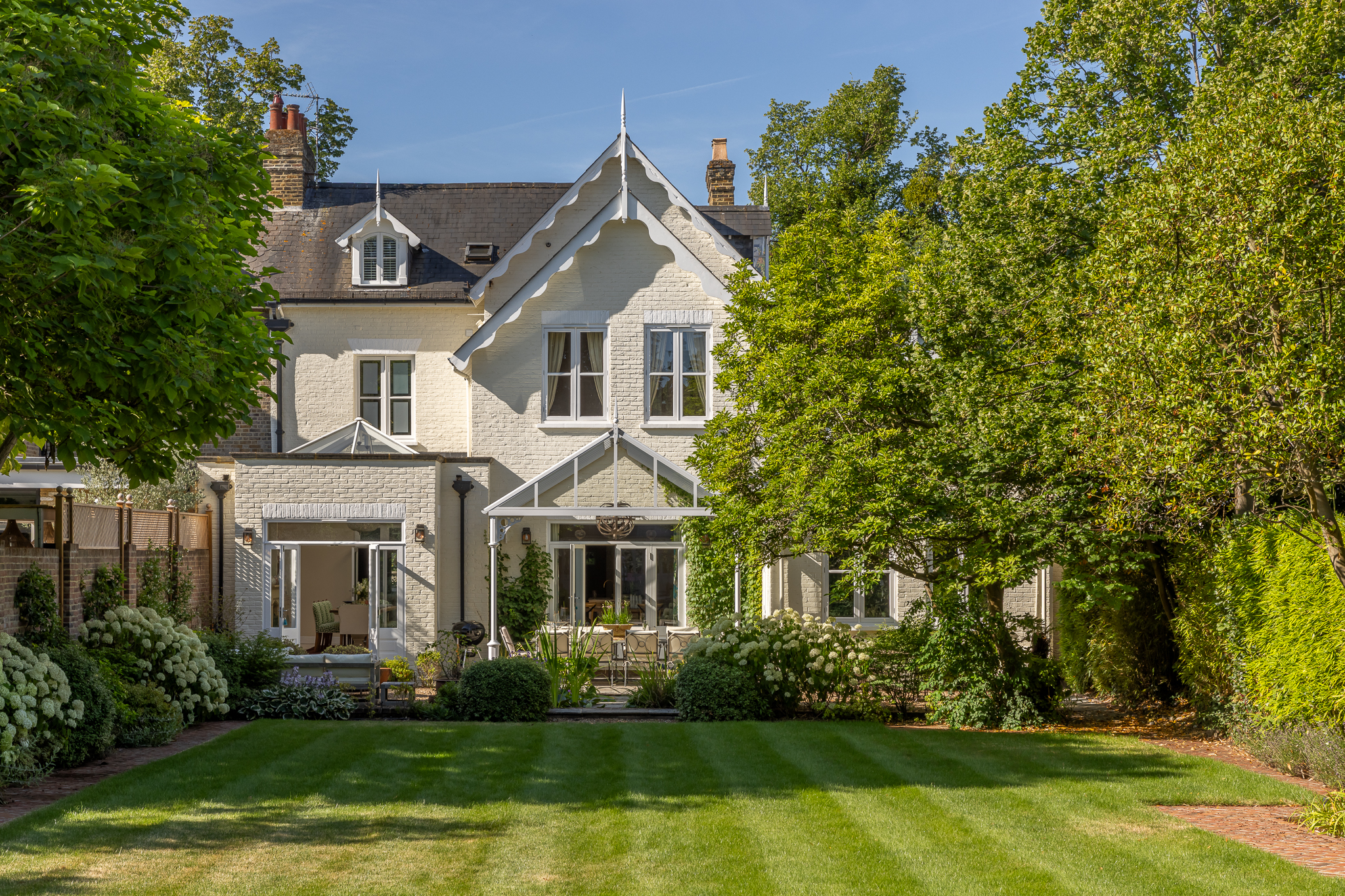 Orangery facing onto lush rear garden - designed by Lindi Reynolds & co