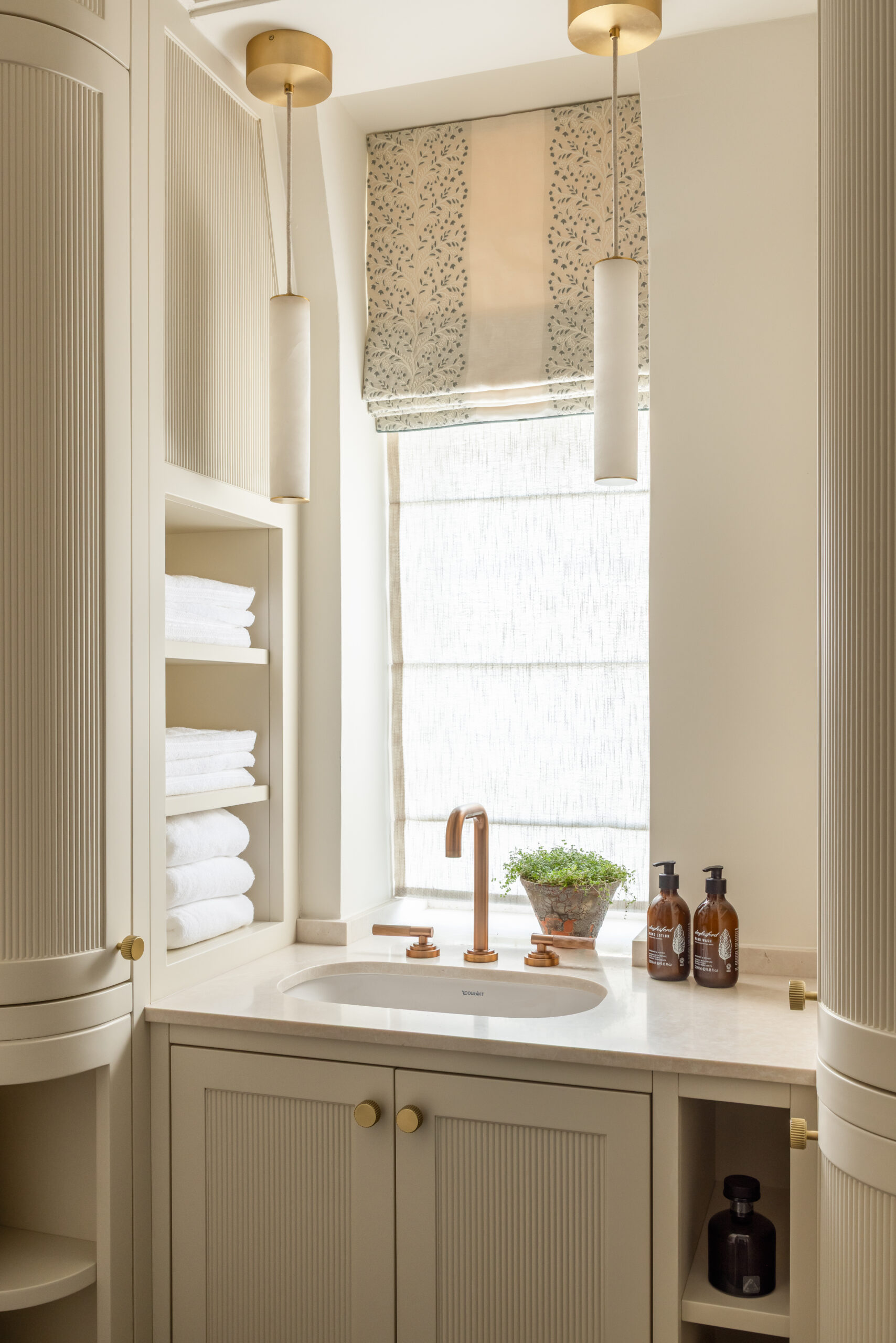 Image of a master bathroom in a Chelsea pied-a-terre renovation with complete bespoke cabinetry